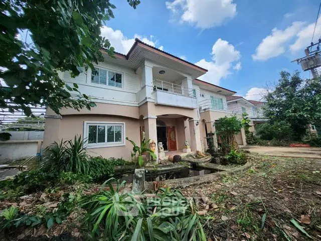 Spacious two-story house with lush garden and charming entrance