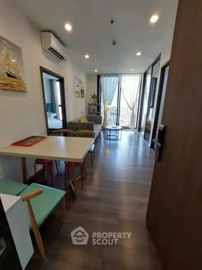 Modern open-plan living room with stylish decor and natural light