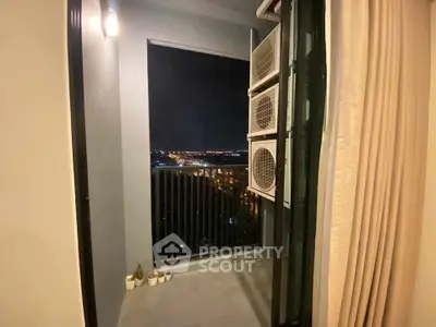 Charming balcony with night city view, perfect for relaxation and enjoying the skyline.