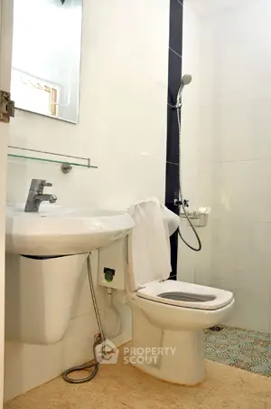 Modern bathroom with sleek fixtures and stylish tile flooring