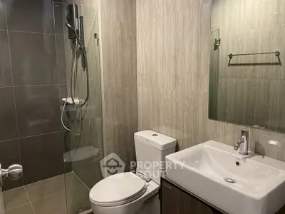 Modern bathroom with sleek design and glass shower enclosure