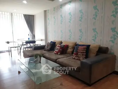 Spacious living room with stylish decor and natural light