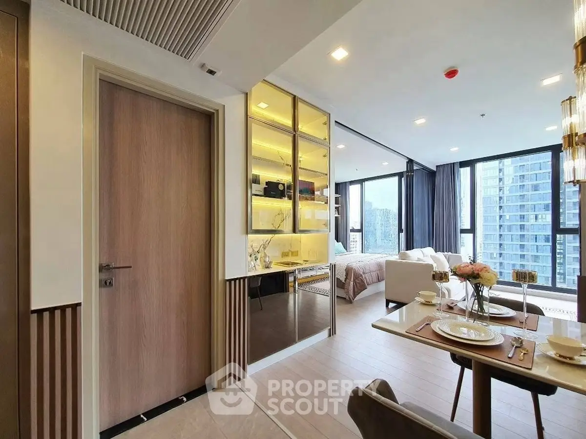 Luxurious modern apartment with open living and dining area, featuring floor-to-ceiling windows and elegant decor.