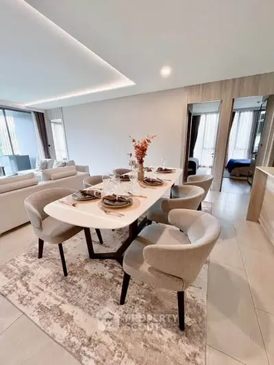 Elegant open-plan dining area with modern decor and natural light