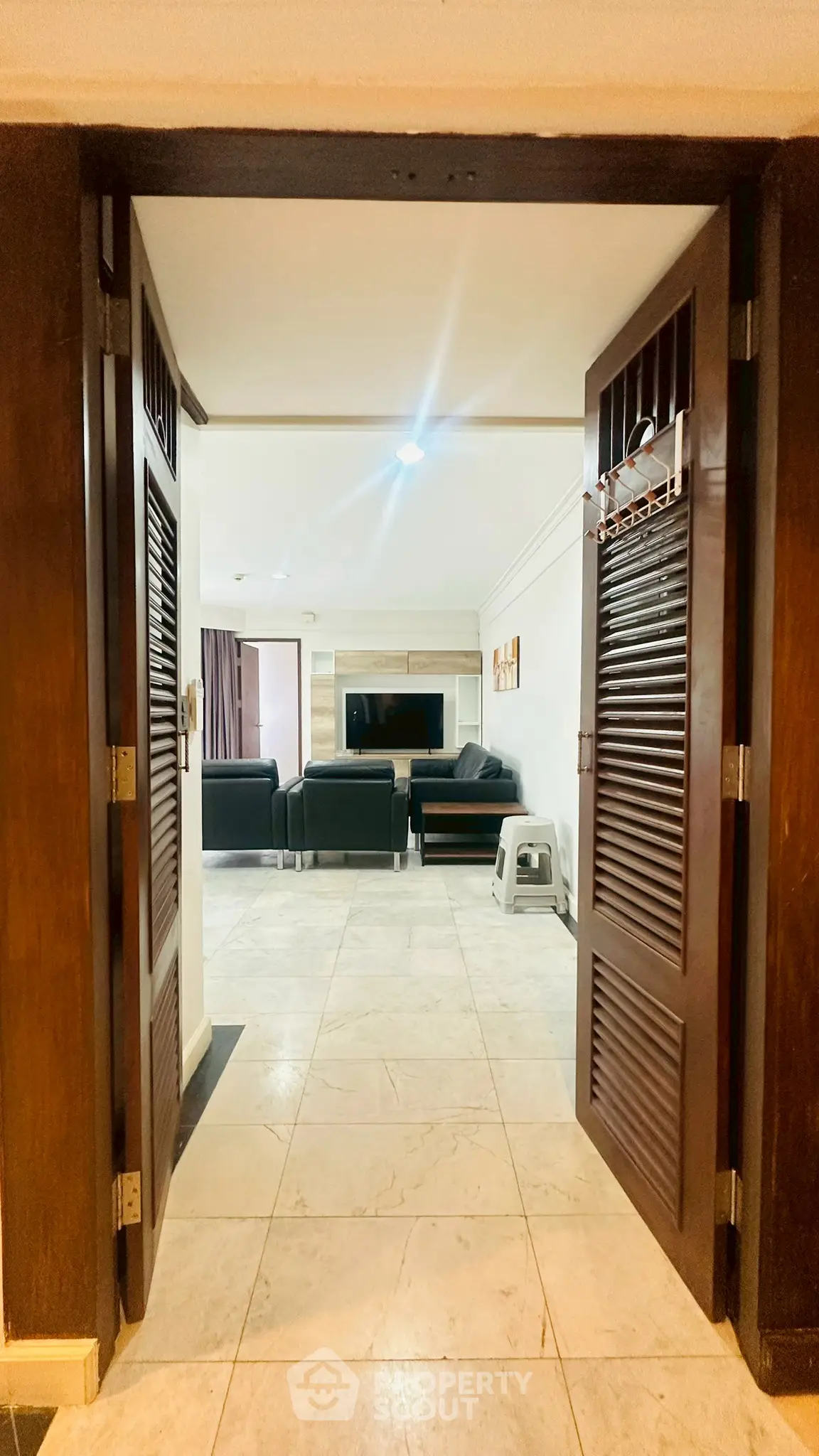 Spacious living room with elegant furniture and stylish decor, perfect for modern living.