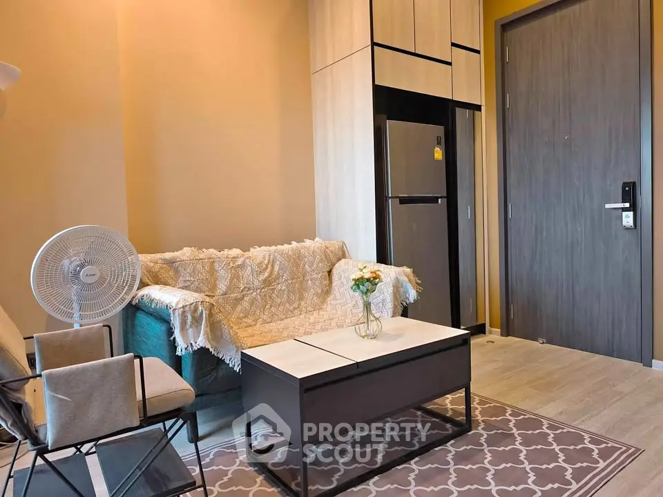 Cozy living room with modern furniture and stylish decor in a contemporary apartment.