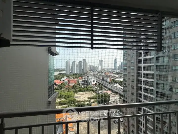 Stunning cityscape view from high-rise balcony with modern architecture.