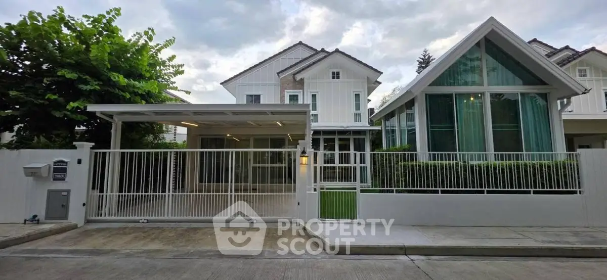 Stunning modern house with sleek architecture and spacious driveway in a serene neighborhood.