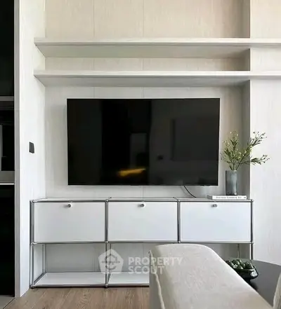 Modern living room with sleek TV setup and minimalist decor