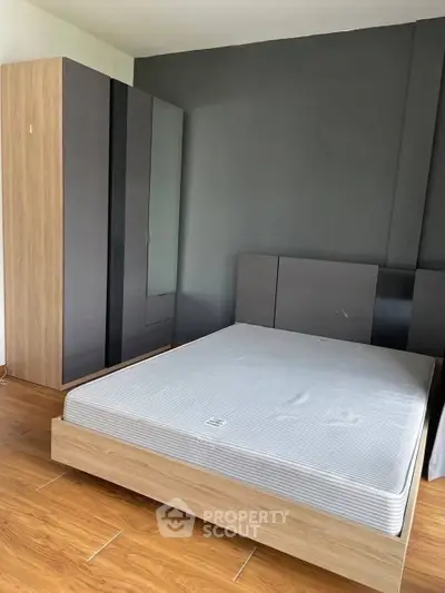 Modern bedroom with sleek wardrobe and minimalist design