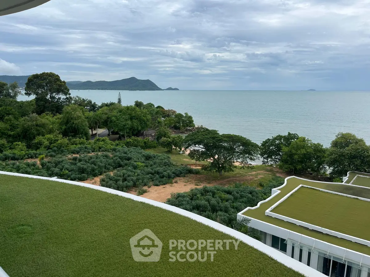 Stunning ocean view from a modern building with lush greenery and serene surroundings.