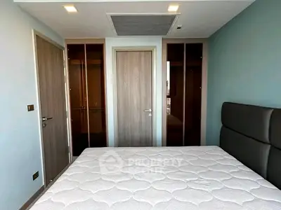 Modern bedroom with minimalist design and ample natural light