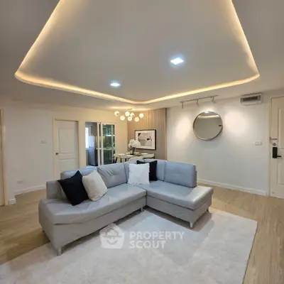 Modern living room with stylish lighting and cozy sectional sofa