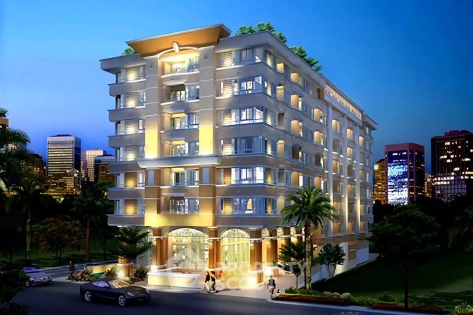 Stunning modern apartment building with illuminated facade and lush surroundings in vibrant cityscape.