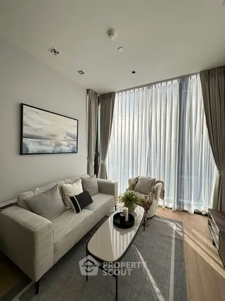 Elegant living room with floor-to-ceiling windows and modern decor