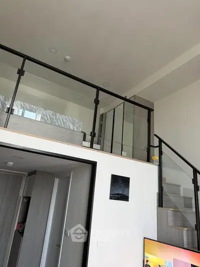 Modern loft apartment with glass railing and stylish interior design