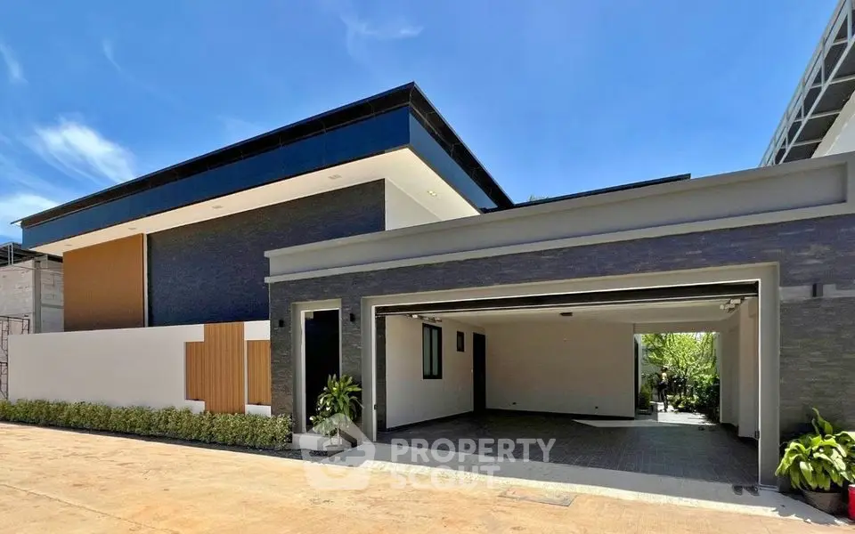 Modern luxury home exterior with spacious garage and sleek architectural design