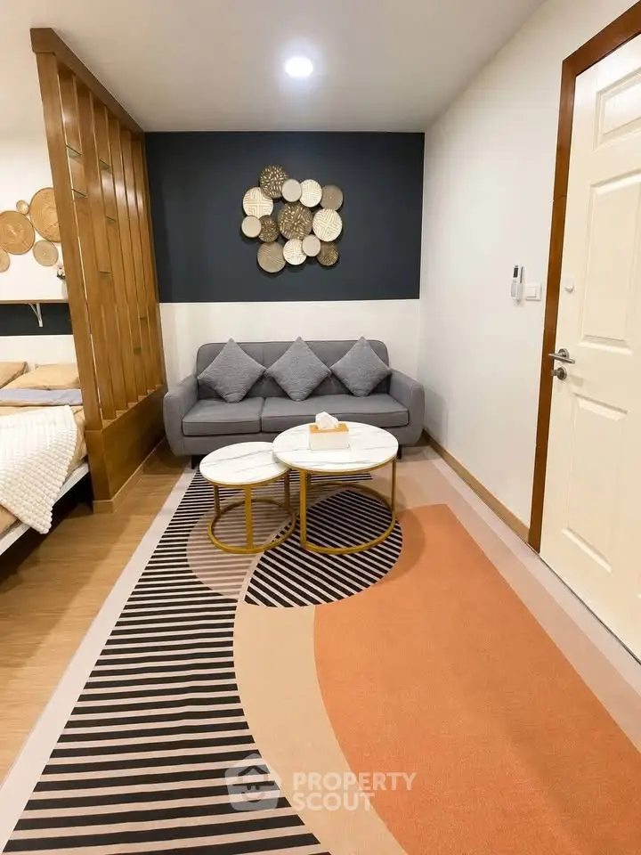 Stylish living room with modern decor and cozy seating area in a contemporary apartment.