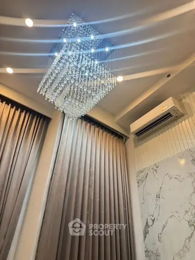Luxurious interior with elegant chandelier and modern air conditioning unit