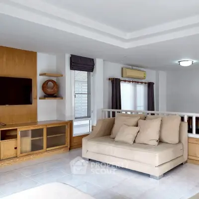 Spacious living room with modern decor and natural light