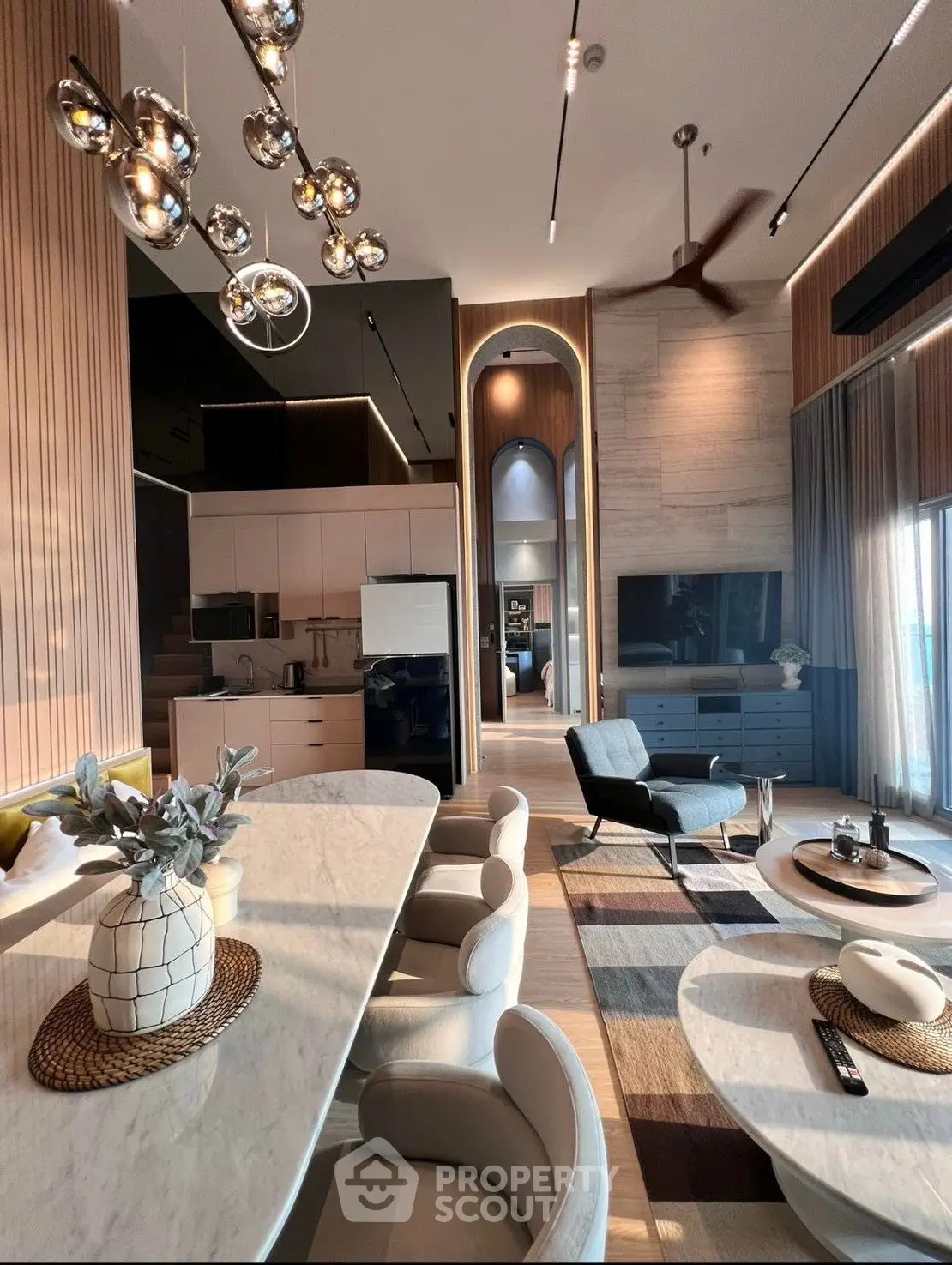 Luxurious modern living room with elegant decor and high ceilings