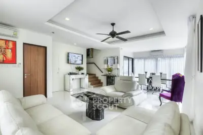 Luxurious modern living room with elegant decor and open dining area