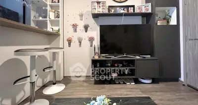 Charming living room with modern decor and entertainment center, perfect for cozy gatherings.