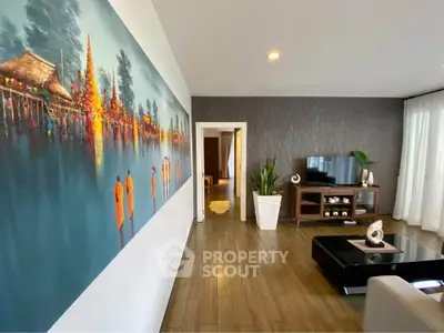 Stylish living room with modern decor and large artwork on wall