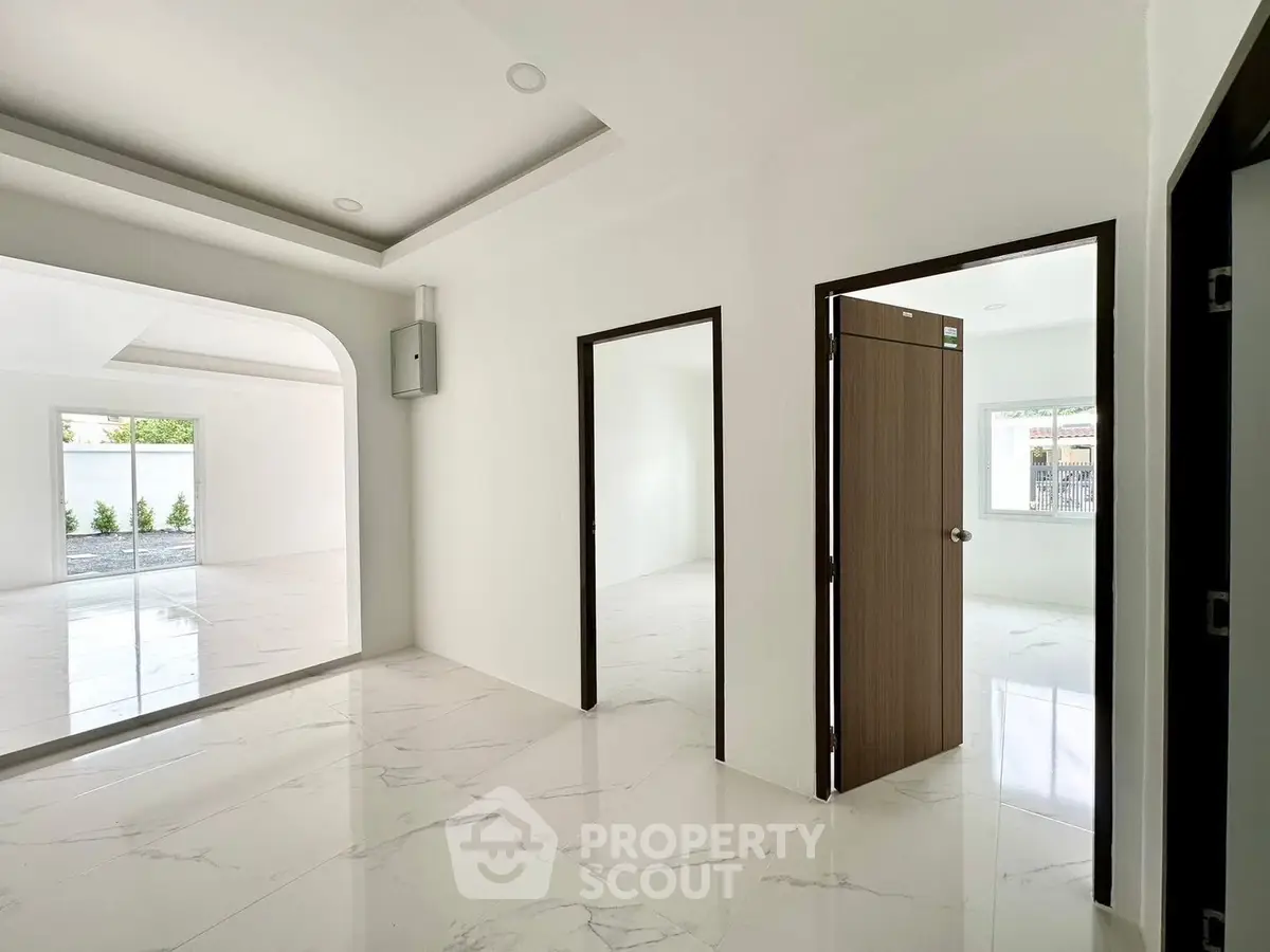 Spacious modern interior with marble flooring and open layout