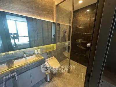 Luxurious modern bathroom with sleek design and glass shower enclosure