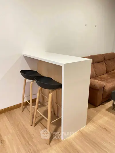 Modern living room with sleek bar counter and stylish stools