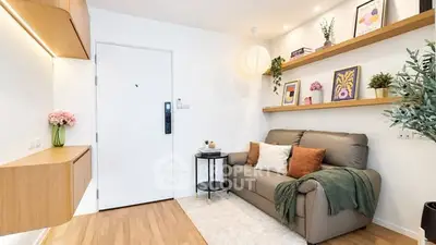 Charming living room with modern decor and cozy seating in a stylish apartment.