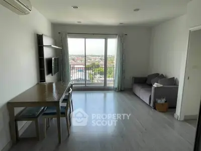 Spacious living room with balcony view in modern apartment