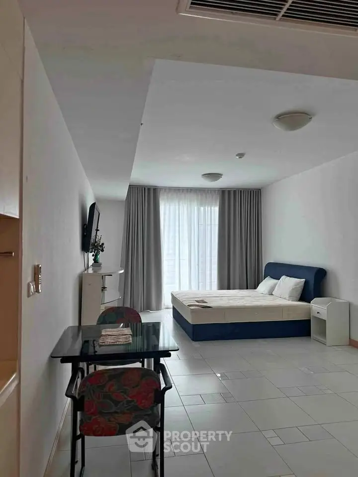 Spacious studio apartment with modern furnishings and natural light