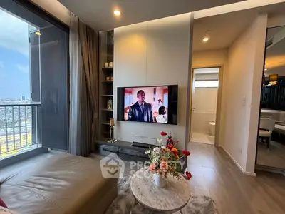 Modern living room with city view, stylish decor, and wall-mounted TV