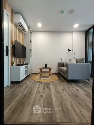 Modern living room with stylish decor and wooden flooring