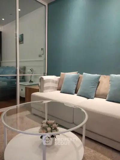 Modern living room with stylish sofa and glass coffee table