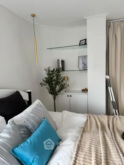 Cozy bedroom with modern decor and stylish shelving