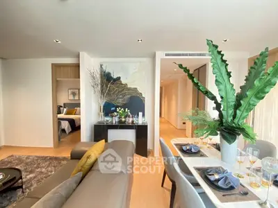 Luxurious open-plan living and dining area with modern decor and elegant furnishings.