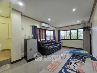 Spacious living room with large windows and modern decor