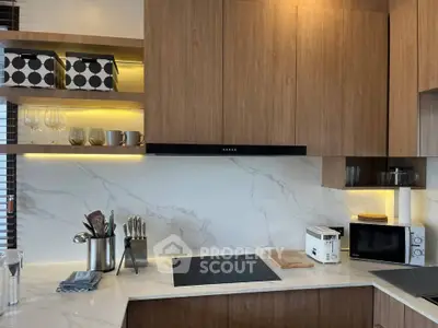 Modern kitchen with sleek wooden cabinets and marble backsplash
