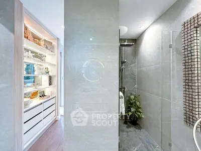 Modern bathroom with sleek shower and stylish shelving unit