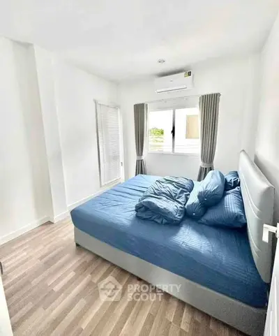 Bright and cozy bedroom with modern decor and natural light