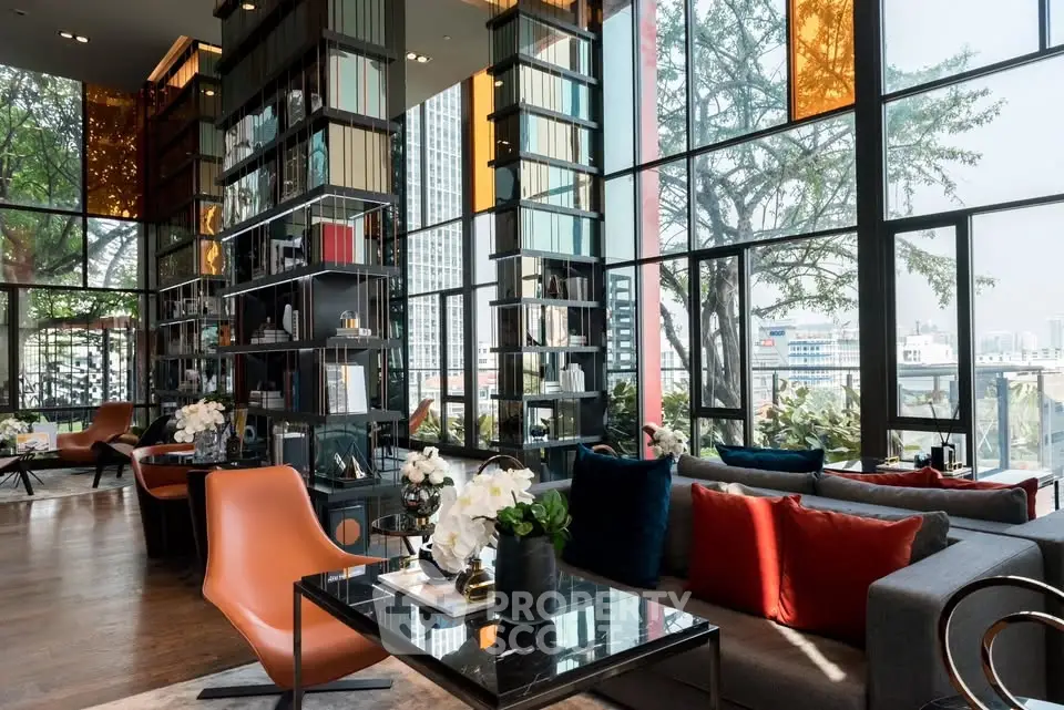 Luxurious modern living room with floor-to-ceiling windows and stylish decor in urban setting.