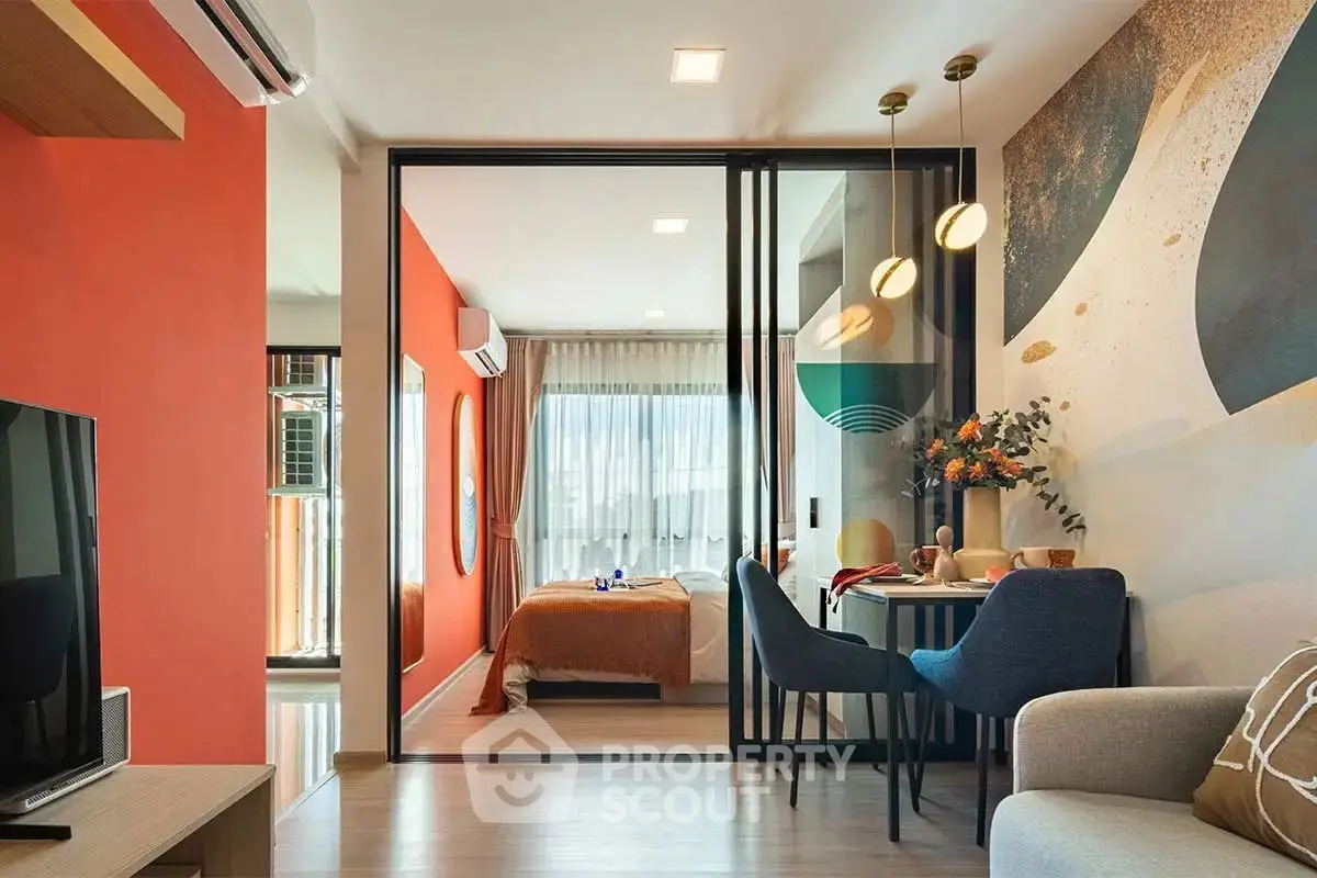 Modern open-plan living room with vibrant decor and cozy dining area.