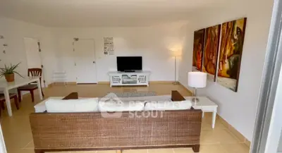 Spacious living room with modern decor and stylish furniture, perfect for relaxation and entertainment.