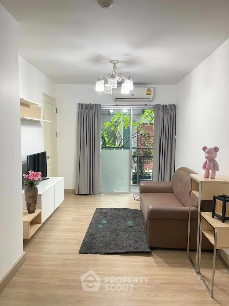 Modern living room with balcony access and stylish decor