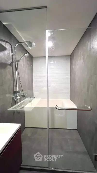 Modern bathroom with sleek glass shower and elegant tile design