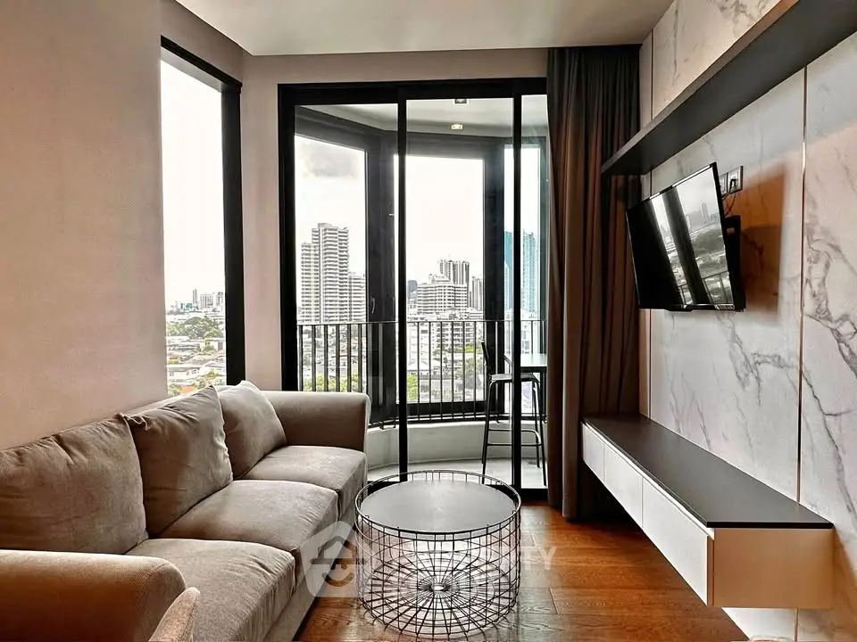 Modern living room with city view, featuring sleek furniture and floor-to-ceiling windows.