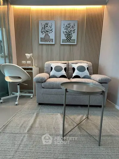 Modern living room with stylish decor and cozy seating area.